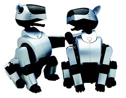 A photograph of two silver ERS-210 units sitting side-by-side and looking at one another. The one on the left has its paw outstretched and place onto its buddy's shoulder.